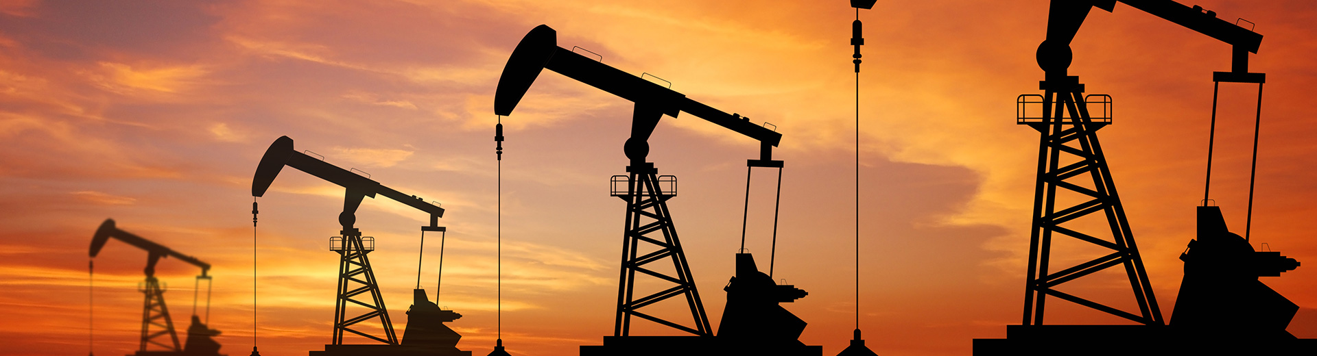 Banner image: oil rigs at sunset